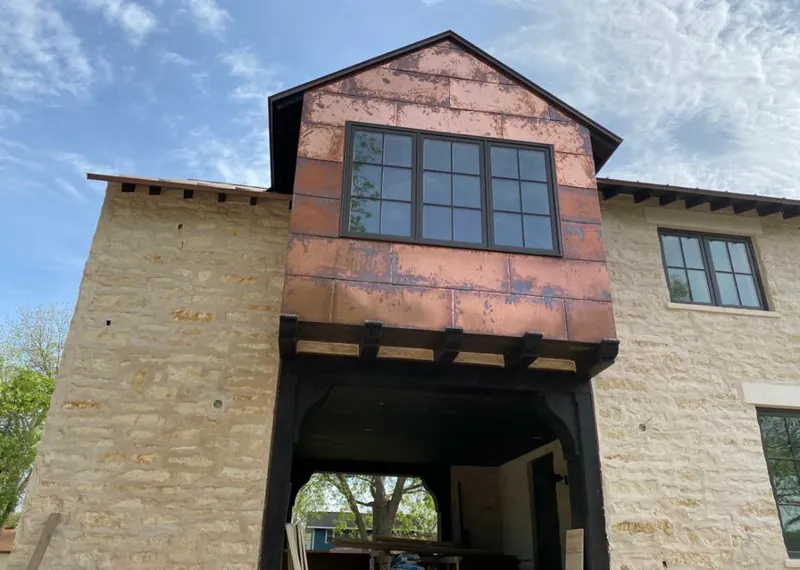 Copper metal panel facade on a stone building for Skylight Installation in Folsom