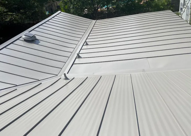Solar attic fan installed on a metal roof for Roof Ventilation in Folsom